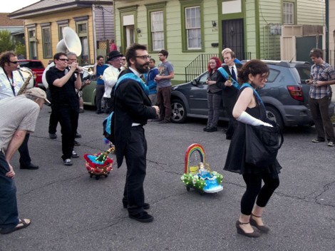 image of people with miniature mardi gras floats
