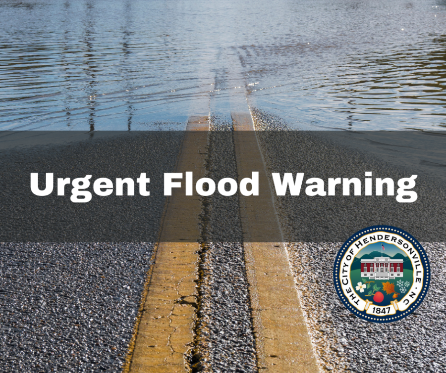 Urgent flood warning graphic, with water covering a street.