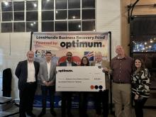 people with large donation check from optimum