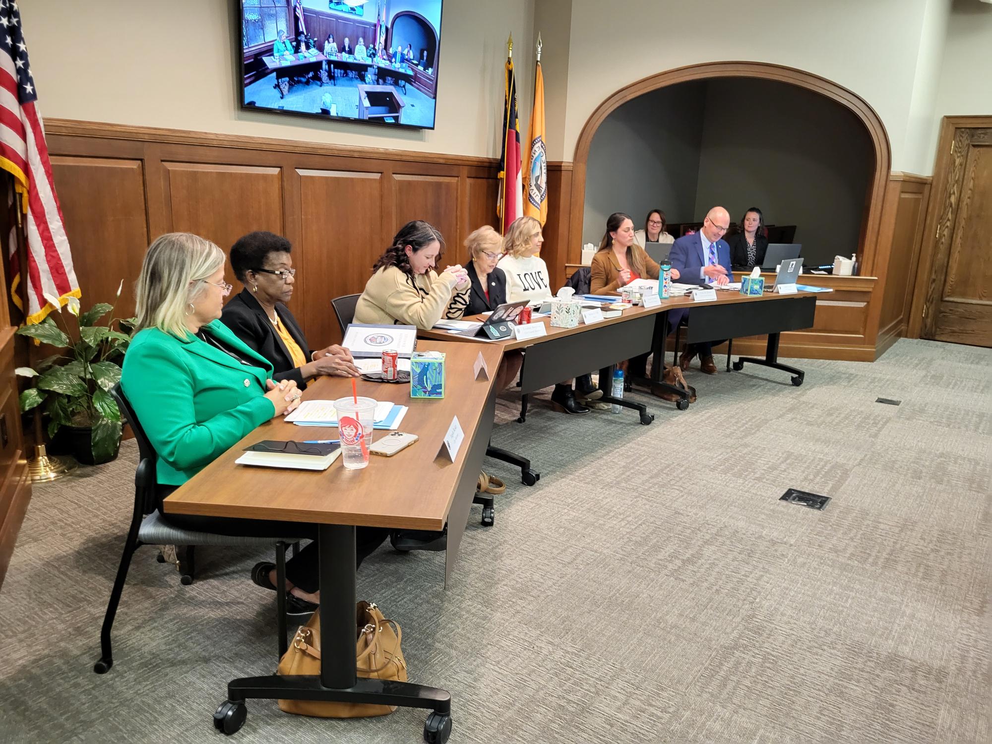 5 female council members at desks