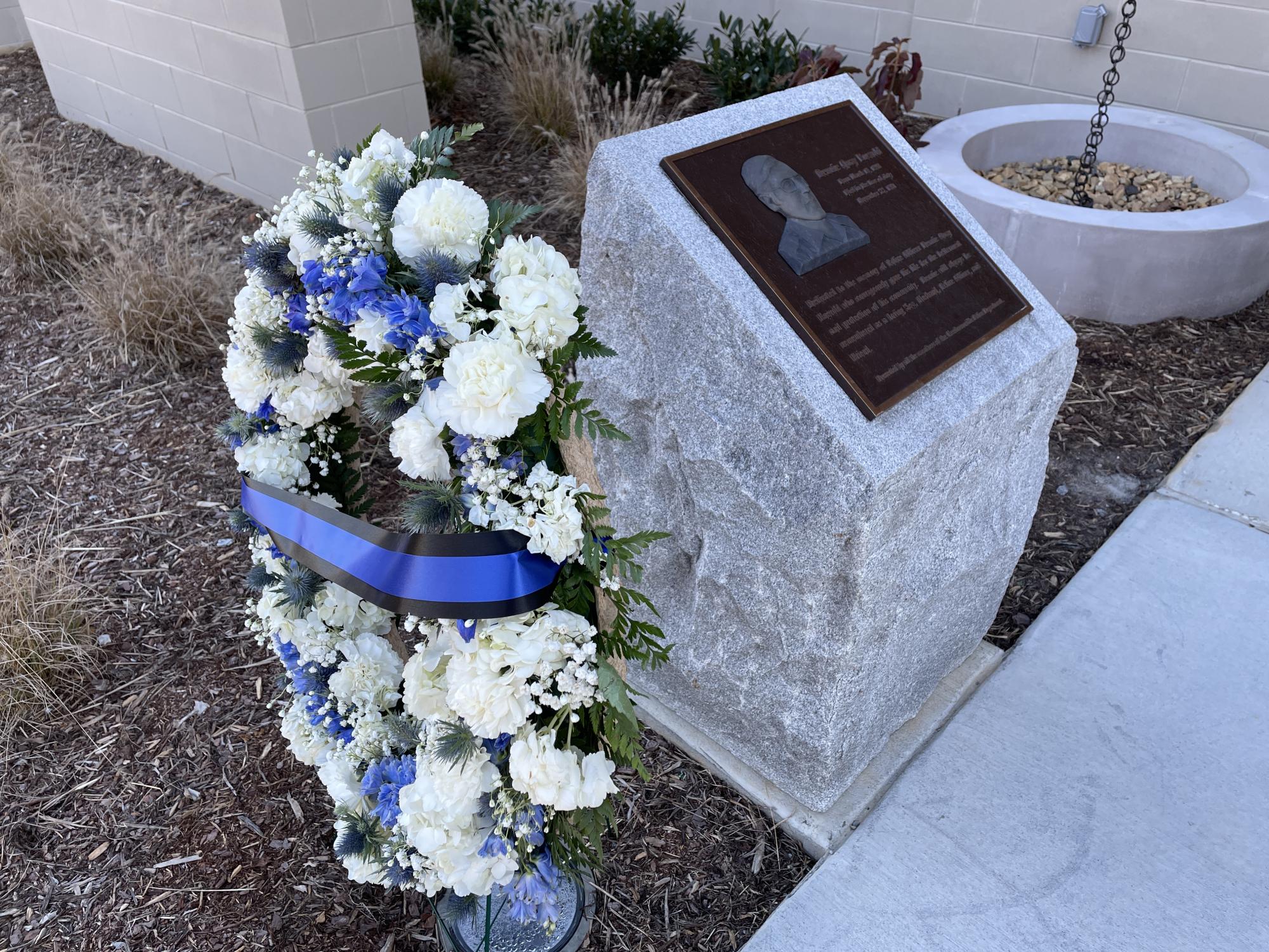 Memorial stone for Officer Enevold outside the Hendersonville police station